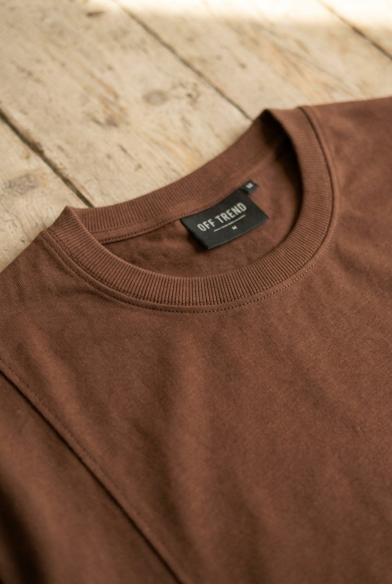Ribbed neck. Double-stitched.